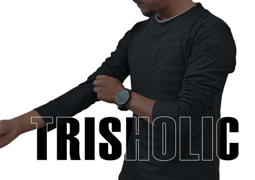 Person wearing a black long-sleeve shirt with 'TRISHOLIC' text overlay.