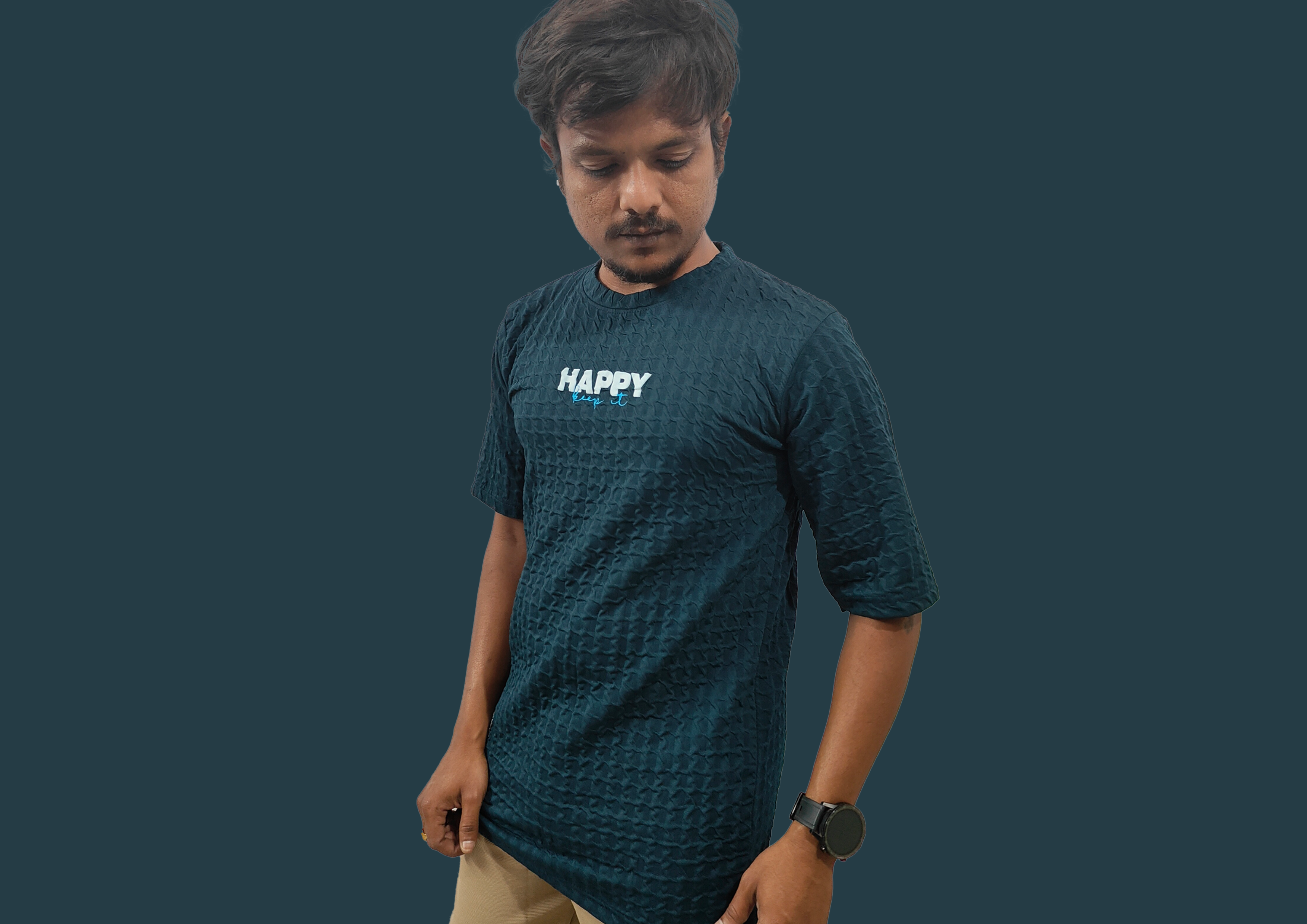 Person wearing a dark blue t-shirt with 'HAPPY' text on a plain background