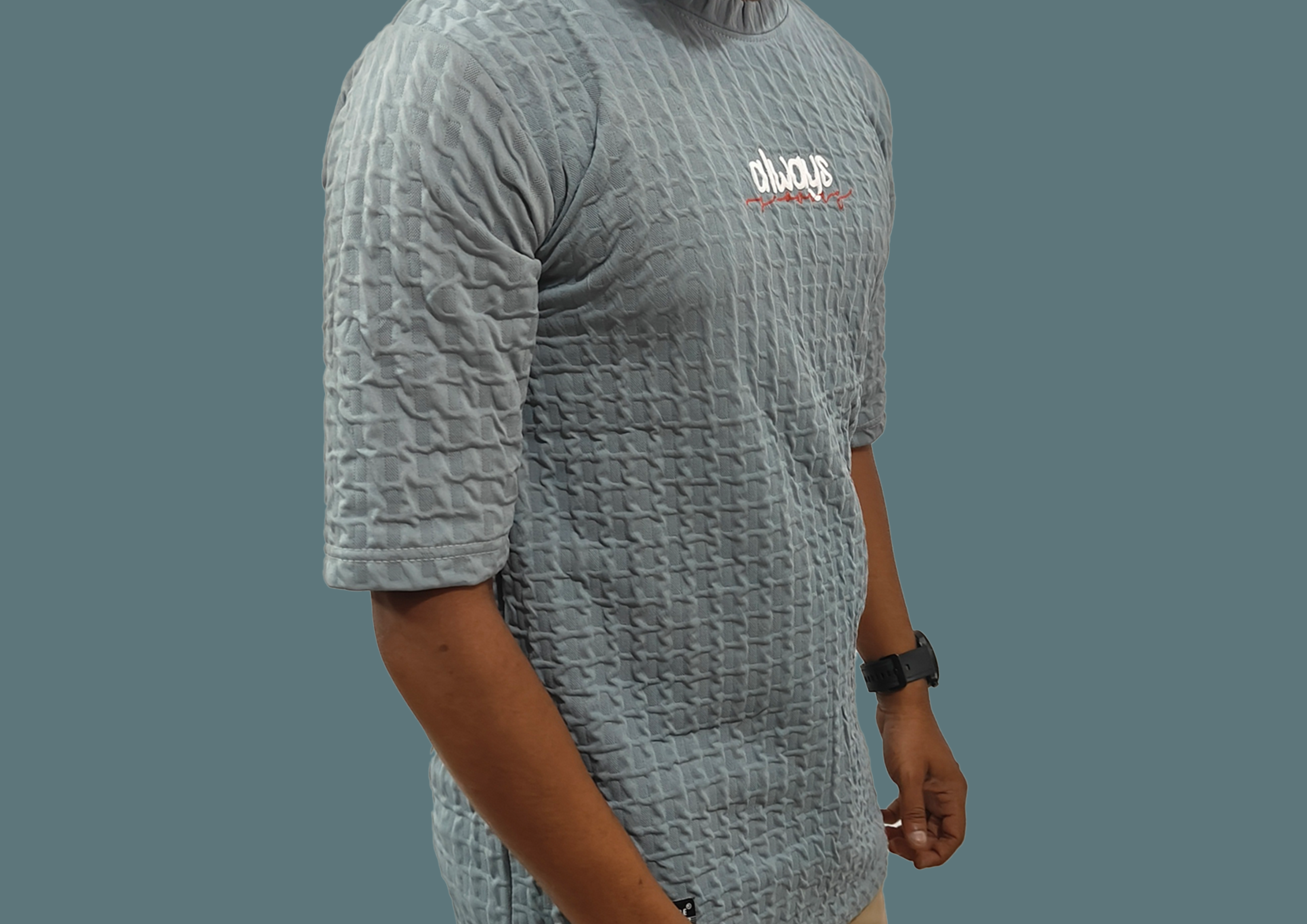 Man wearing a pink shirt against a pink background