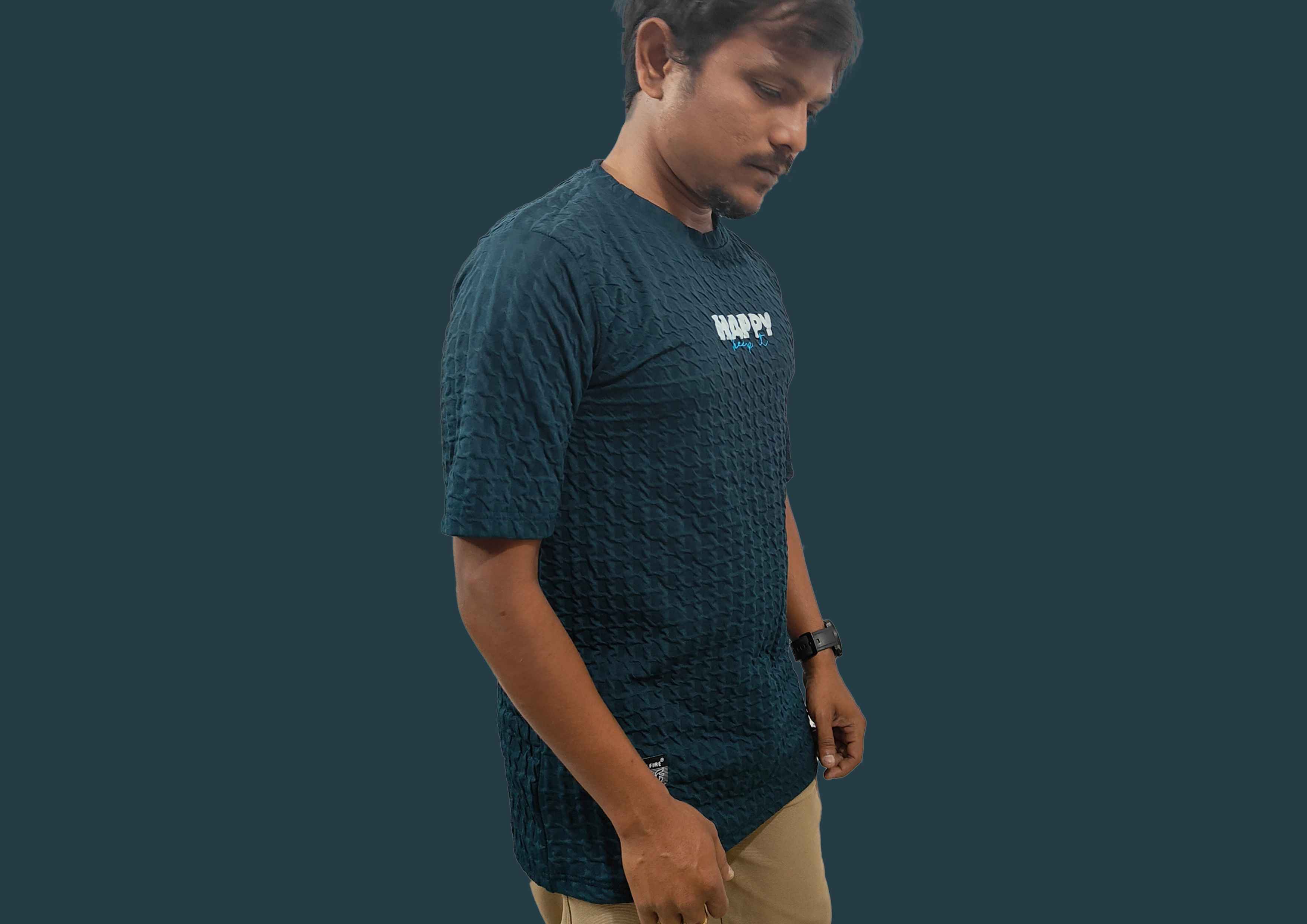 Man wearing a dark blue textured t-shirt with 'HAPPY' text on a plain background